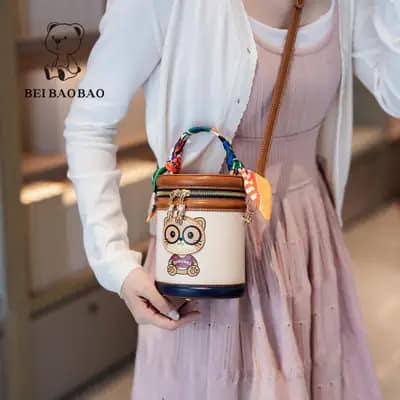 کیف وارداتی تدی بند چرمی قهوه‌ای و کرمی