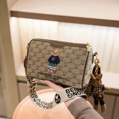 کیف وارداتی تدی گلدوزی جنس کنف بند برزنتی قهوه‌ای و کرمی