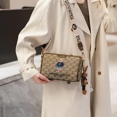 کیف وارداتی تدی گلدوزی جنس کنف بند برزنتی قهوه‌ای و کرمی