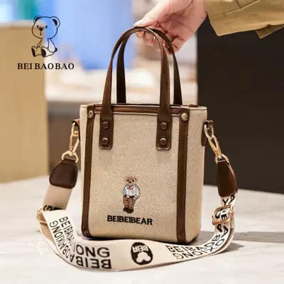 کیف وارداتی تدی گلدوزی جنس کنف بند برزنتی کرم قهوه ای
