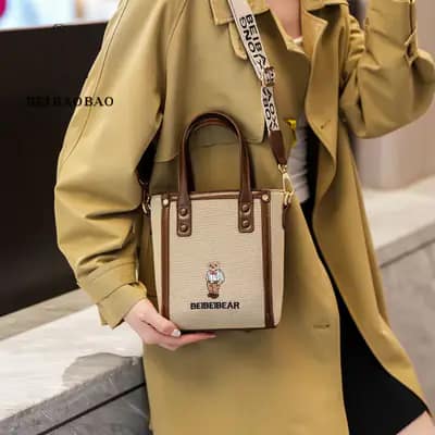 کیف وارداتی تدی گلدوزی جنس کنف بند برزنتی کرم قهوه ای
