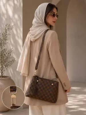 کیف دستی و دوشی زنانه چرم LV مونوگرام قهوه‌ای روی جعبه نارنجی برند