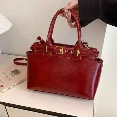 کیف دستی و دوشی وارداتی زنانه چرم واکسی رنگ زرشکی مدل هلنا نلارامد